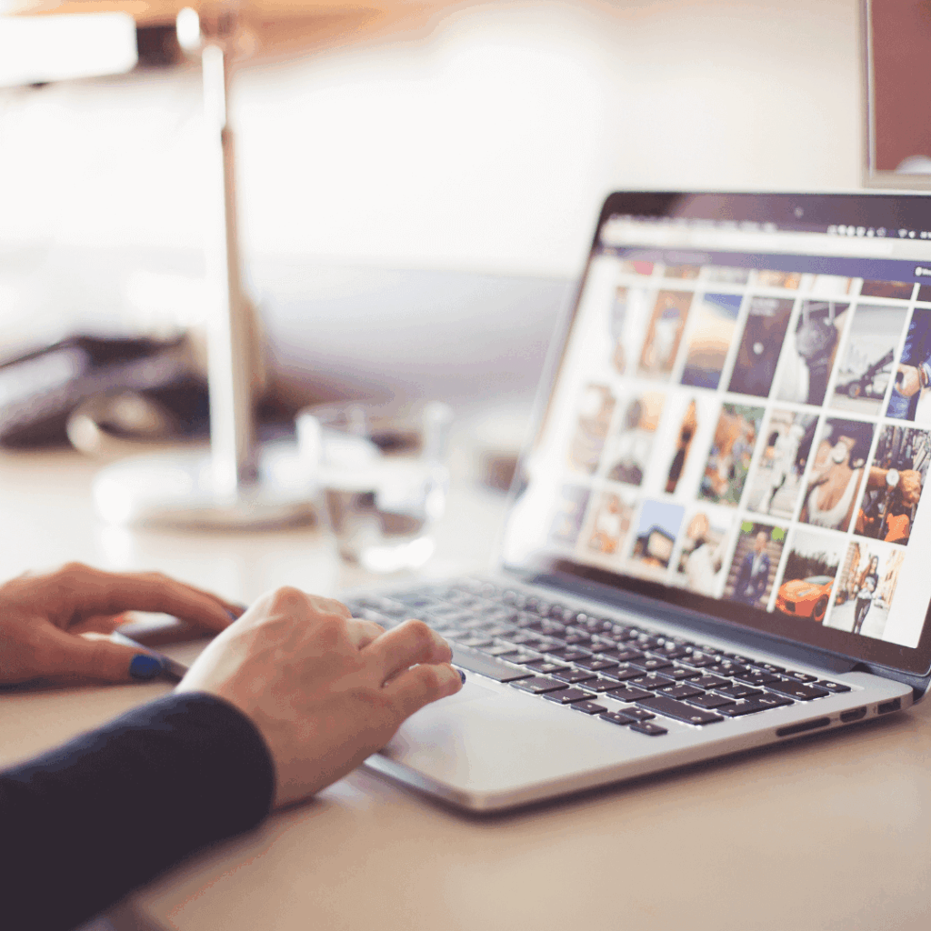 A picture of someone scrolling on their computer.