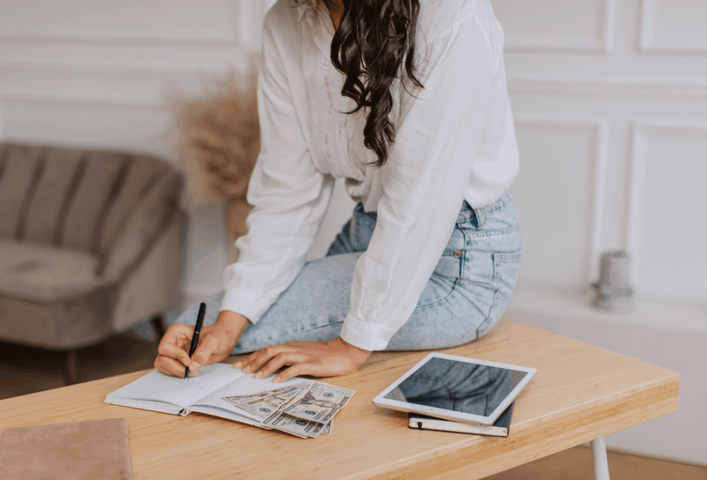 photo of a woman calculating her marketing budget